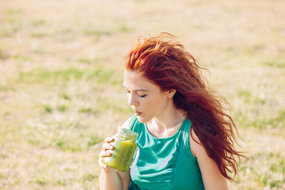 Mid adult woman eating food