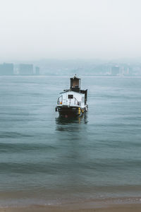 Boat in sea against sky