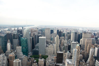 High angle view of buildings in city against sky