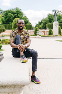 Positive afro american stylish man in european city