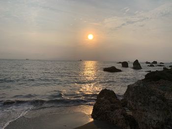 Scenic view of sea against sky during sunset