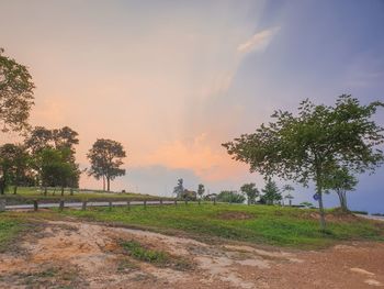 Scenic view of field against sky during sunset