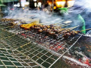 Close-up of meat on barbecue grill