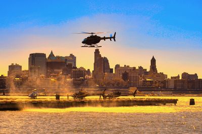 Cityscape against clear sky during sunset