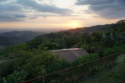 Scenic view of mountains against sky at sunset