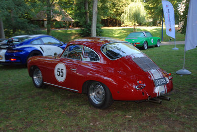 Red toy car on field