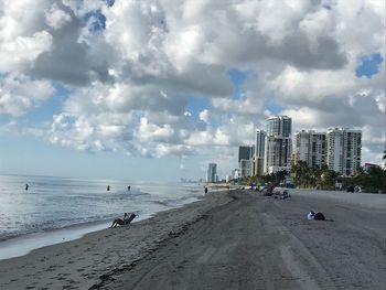 Scenic view of beach against sky in city