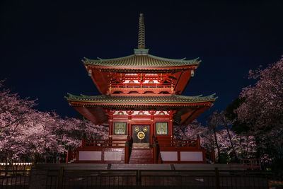 Low angle view of illuminated building at night