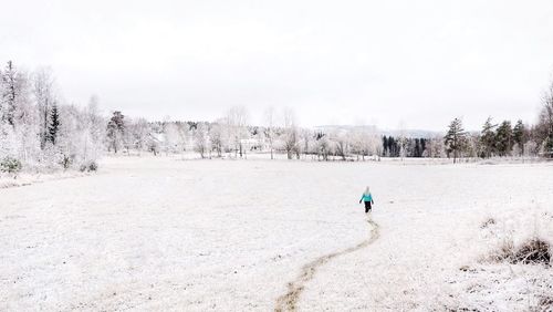 Scenic view of snow covered landscape against clear sky