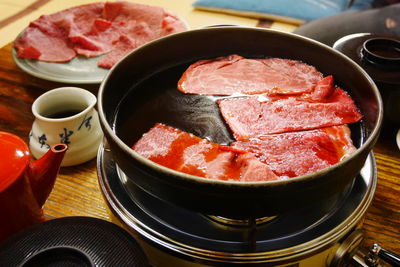 High angle view of meat in container on table