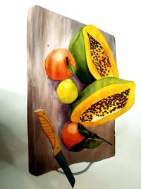 High angle view of oranges on cutting board