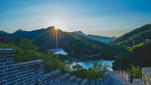 Scenic view of mountains against blue sky