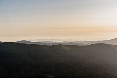 Scenic view of mountains against sky during sunset