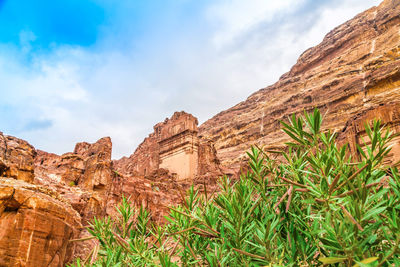 Low angle view of rock formation against sky