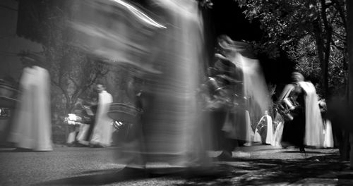 Blurred motion of woman in dark