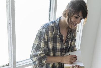 Side view of man working at home