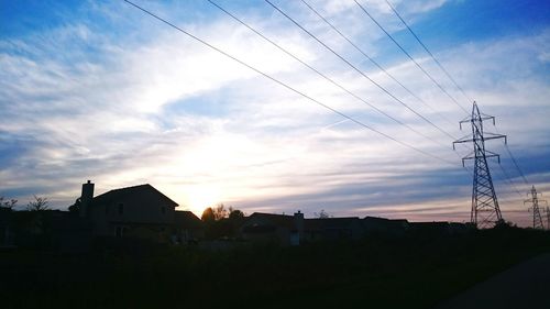 Low angle view of building against cloudy sky