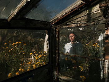 Portrait of man seen through glass window