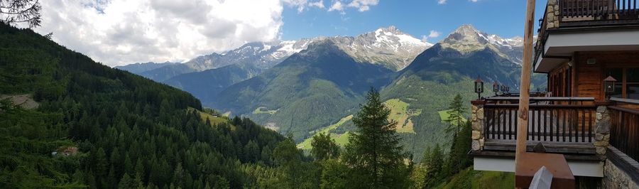 Panoramic shot of building and mountains against sky