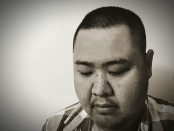 Close-up portrait of a serious young man