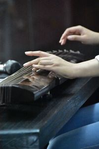 Cropped image of man playing guitar