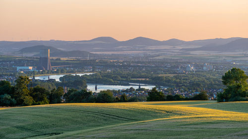 Scenic view of field against sky during sunset