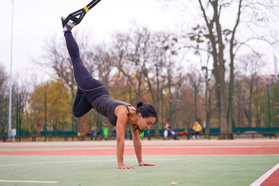 Side view of woman exercising