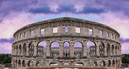 Historic building against cloudy sky