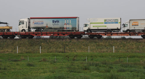 Train on field against sky