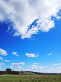 Scenic view of landscape against blue sky