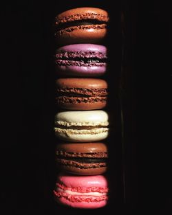 Close-up of multi colored candies against black background