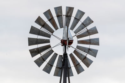 Low angle view of wind turbine against sky