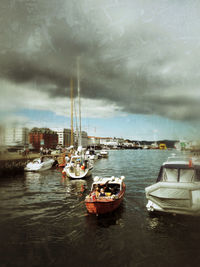 Boats moored at harbor