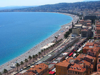 High angle view of sea and buildings against sky