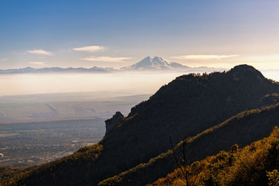 Scenic view of mountains against sky during sunset