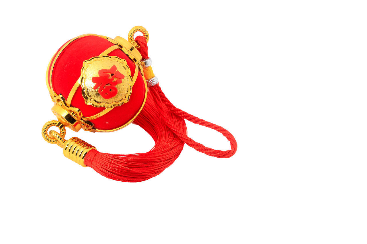 RED CHRISTMAS DECORATION IN WHITE BACKGROUND