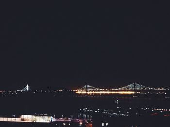 Illuminated bridge at night