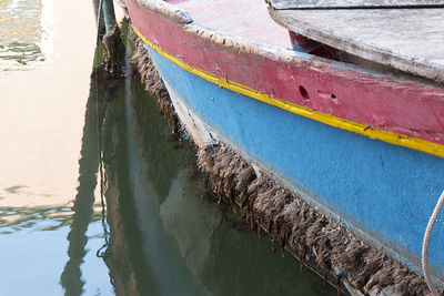 Boats moored on lake