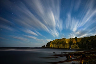 Scenic view of sea against sky at night