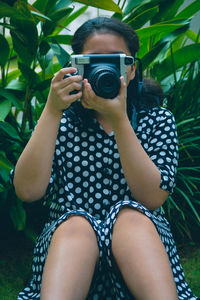 Midsection of man photographing