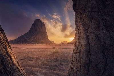 Scenic view of desert against sky during sunset