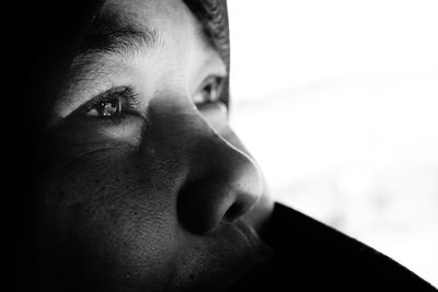 Close-up portrait of young man looking away