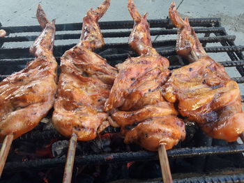 High angle view of meat on barbecue