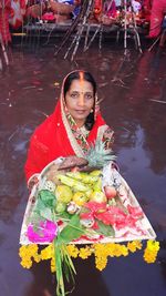 Portrait of smiling woman in traditional clothes