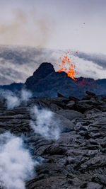 Scenic view of volcanic mountain against sky