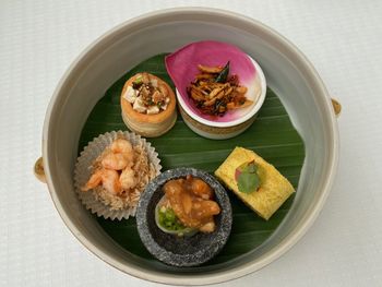 High angle view of afternoon tea snacks served on table