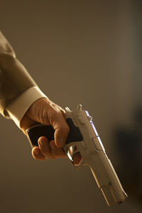 Cropped hand of man playing guitar