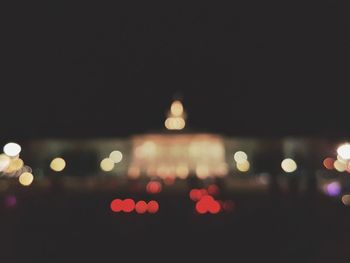 Defocused image of illuminated lights at night