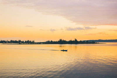 Scenic view of sea against sky during sunrise