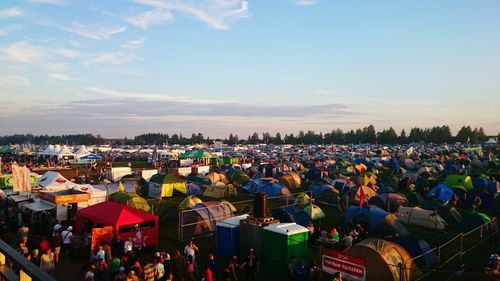 High angle view of tents and people at festival against sky